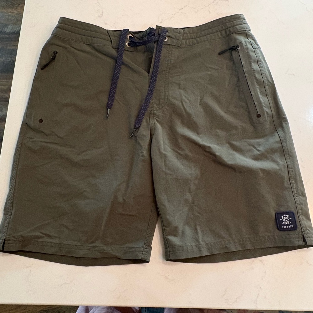 Rip Curl Dark Green board shorts.